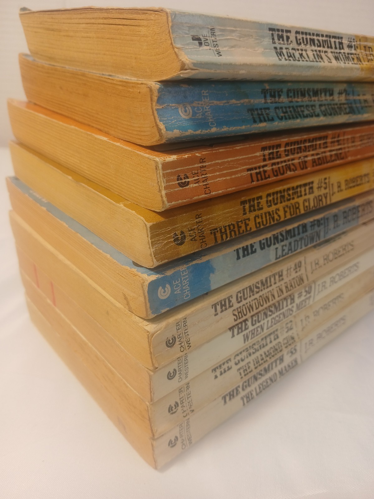 Lo of 9 The Gunsmith – J. R. Robert – Books 1-2, 4-6, 49 ,50, 52, and 55