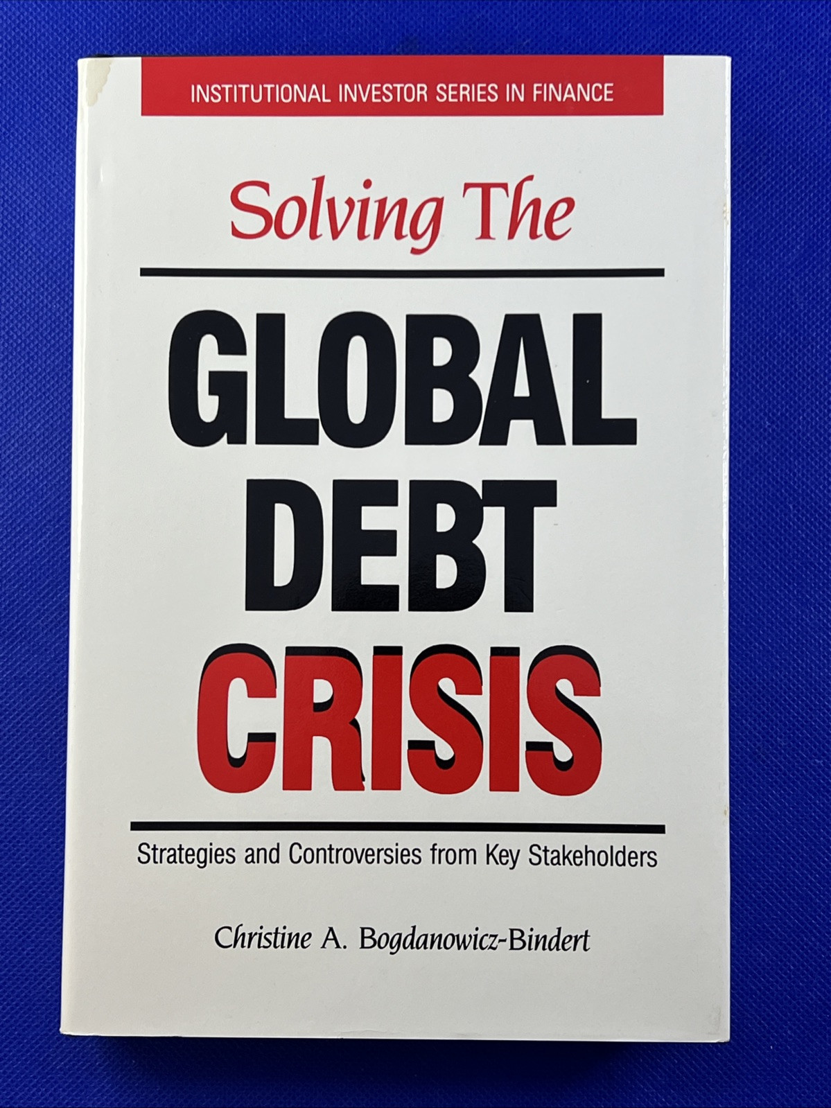 Solving the Global Debt Crisis : Strategies and Controversies from Key…