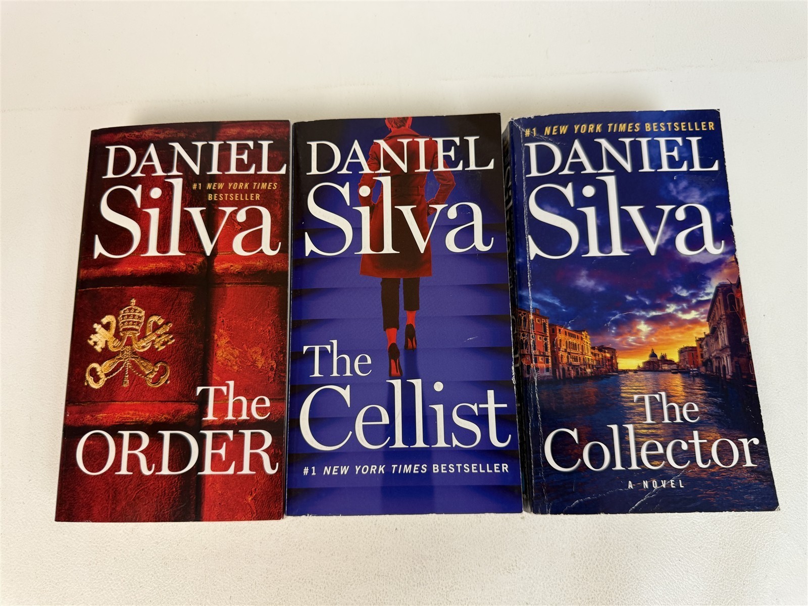 Daniel Silva Lot 23 Paperbacks including 20 Gabriel Allon series