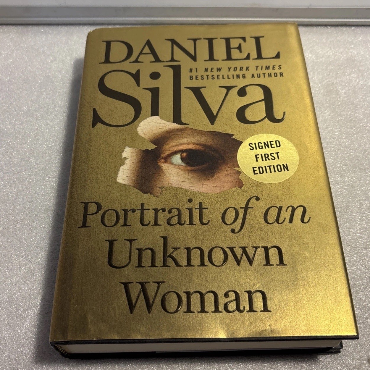 Portrait of an Unknown Woman by Daniel Silva (2022, HC) SIGNED 1st/1st TIpped In